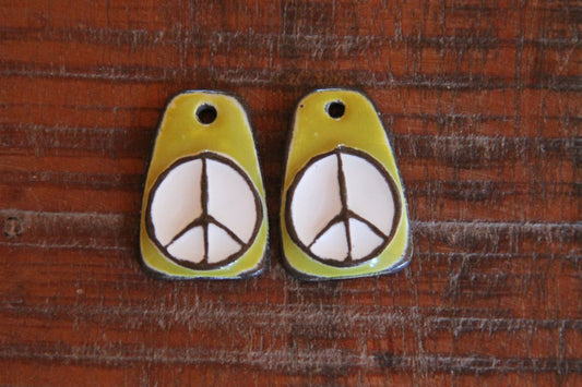 A pair of PEACE ceramic earring dangles