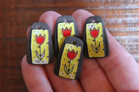 A pair of TULIPS ceramic earring dangles