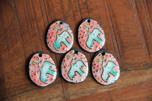 A pair of PEACE DOVE ceramic earring dangles