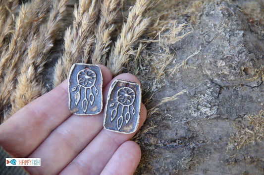 A pair of DREAMCHATCHERS ceramic earring dangles